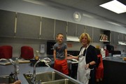 Mrs. Novinger & Jacobi making pancakes.